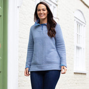 Woman in furrow ditsy sweatshirt