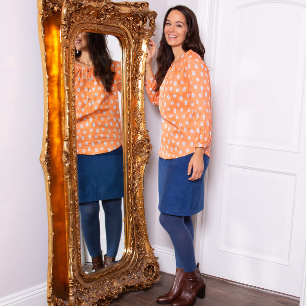 Woman in carey blouse little cub