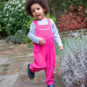 Girl in cord dungarees