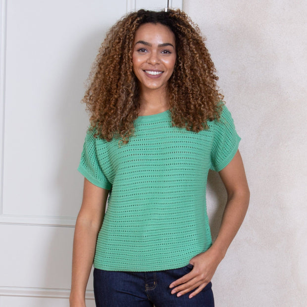 Woman in haven knit top green