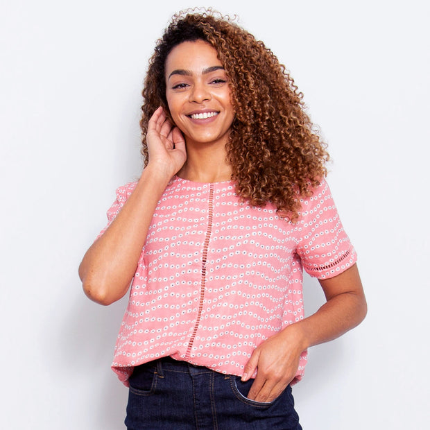 Woman in burstock blouse wavy daisy