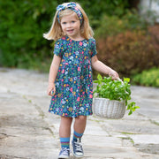 Girl in rainbow zebra socks