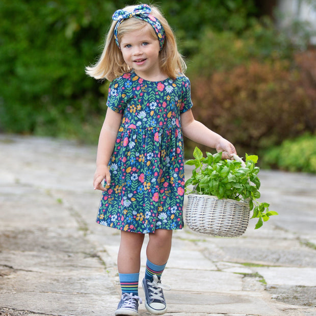 Girl in rainbow zebra socks