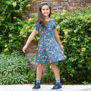 Girl in rainbow zebra socks