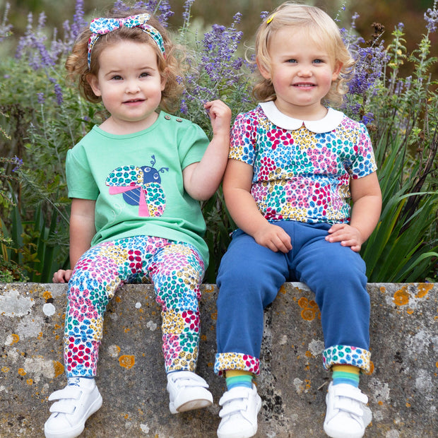 Girl in ladybird ditsy top