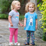 Girl in dolphin rainbow t-shirt