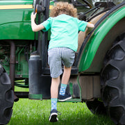 Boy in ticking turn-up shorts