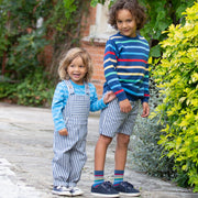 Boy in ticking turn-up shorts