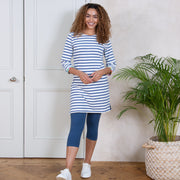 Woman in durdle door dress cream