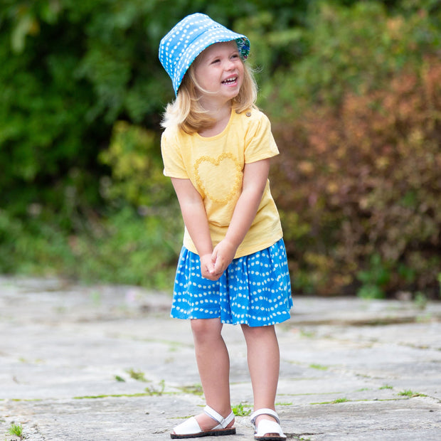 Girl in daisy heart t-shirt