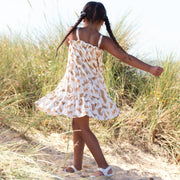 Girl in cat kingdom sundress