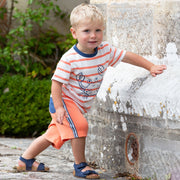Boy in side stripe shorts