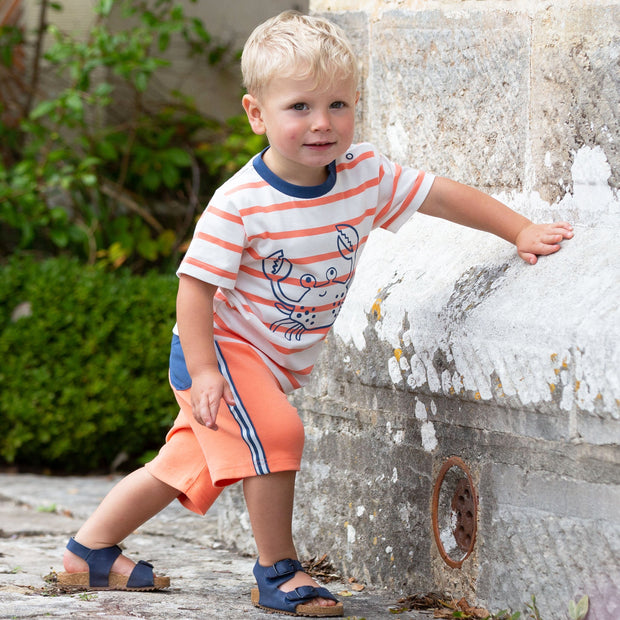 Boy in side stripe shorts