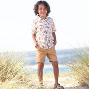 Boy in cat kingdom shirt