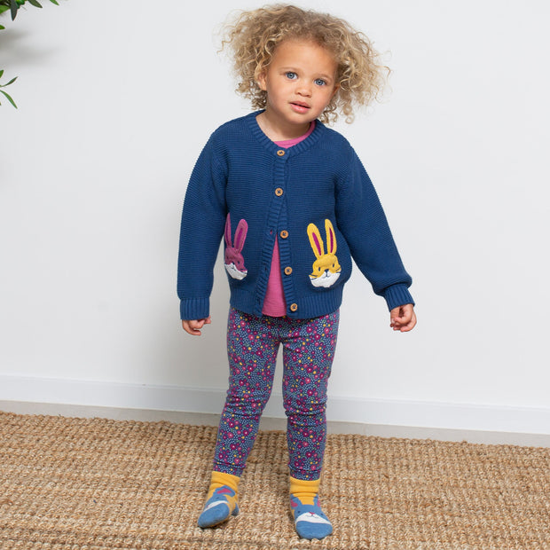 Girl in hoppity grippy socks