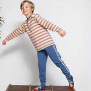 Boy in rainbow rocket socks