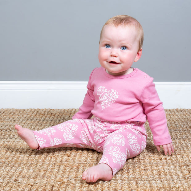 Baby girl in ditsy heart leggings