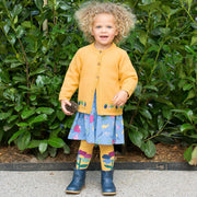 Girl in rainbow flower tights