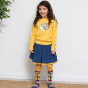 Girl in rainbow flower tights