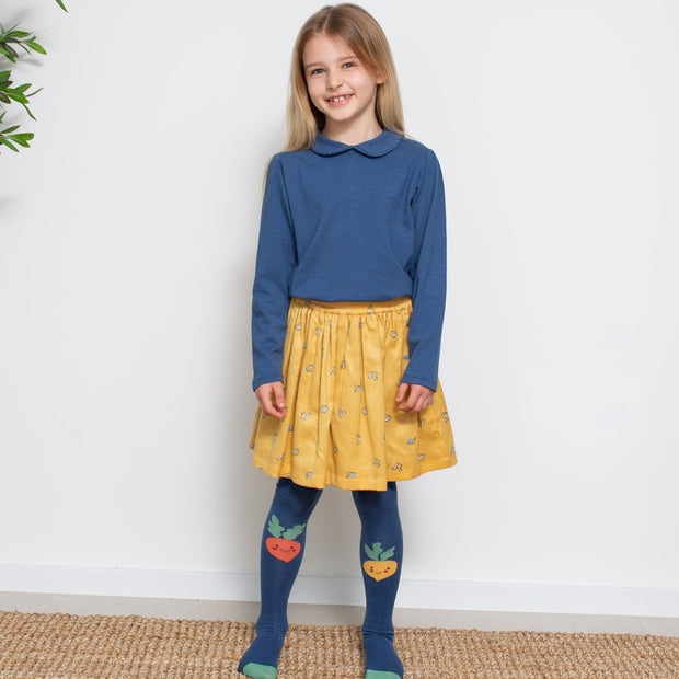 Girl in happy veg tights