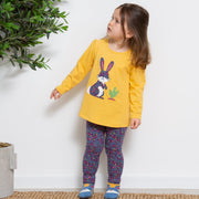 Girl in hoppity skip tunic