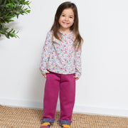 Girl in home ditsy joggers