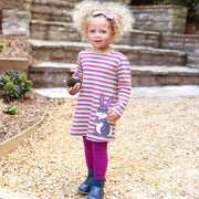 Girl in hoppity skip dress