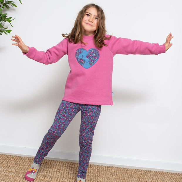 Girl in planet love sweatshirt