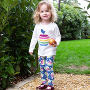Girl in rainbow apple leggings