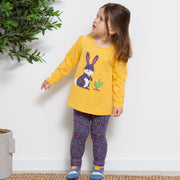 Girl in home ditsy leggings