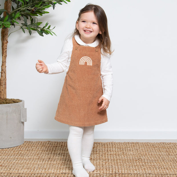 Girl in jumbo cord pinafore