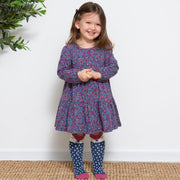 Girl in home ditsy dress