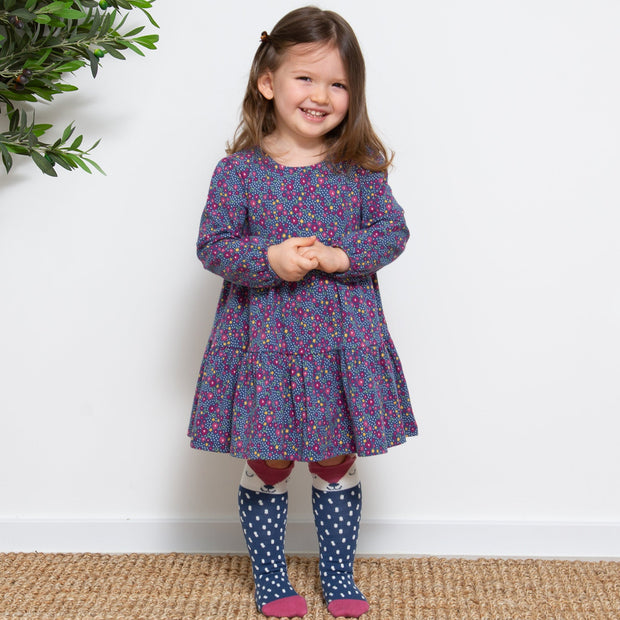 Girl in home ditsy dress