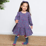 Girl in home ditsy dress
