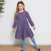 Girl in home ditsy dress