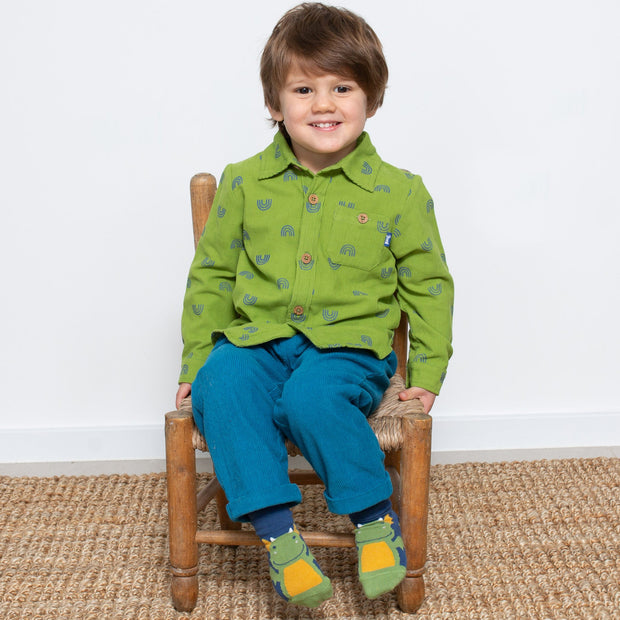 Boy in little dragon socks