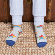 Boy in dragon cosy socks