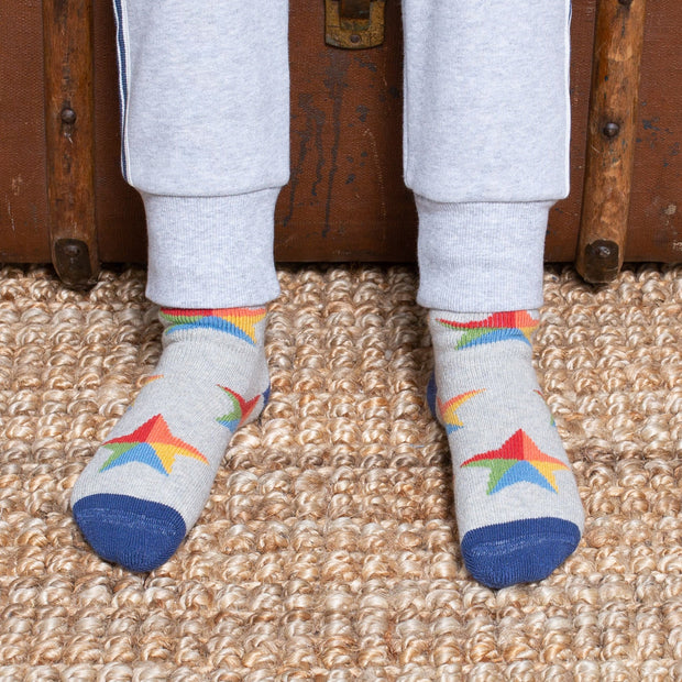 Boy in dragon cosy socks