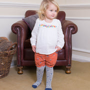 Girl in toadstool body blouse