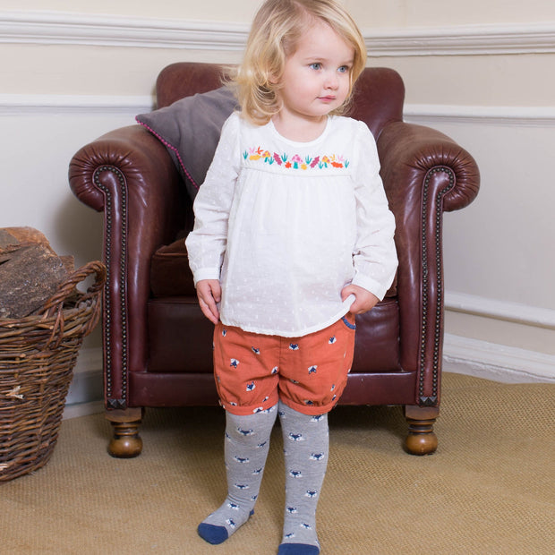 Girl in toadstool body blouse
