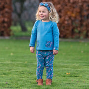 Girl in acorn sweatshirt