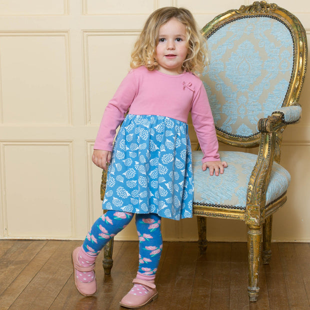 Girl in hedgehog bow dress