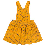 Girl in polka heart pinafore