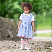 Girl in dotty gingham dress