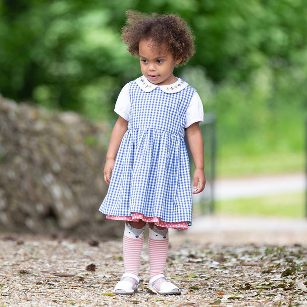 Girl in dotty gingham dress