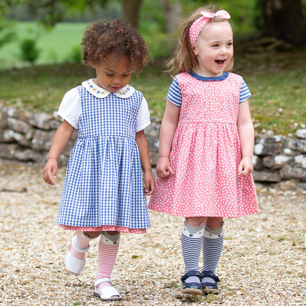 Girl in dotty gingham dress