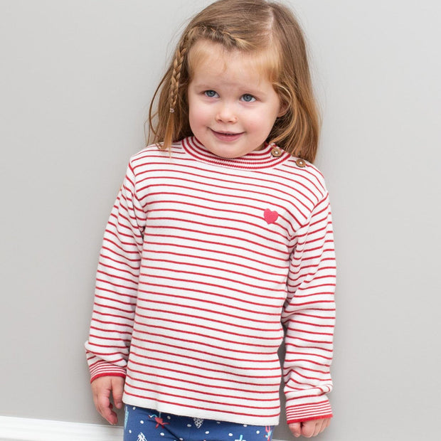 Girl in stripy heart jumper