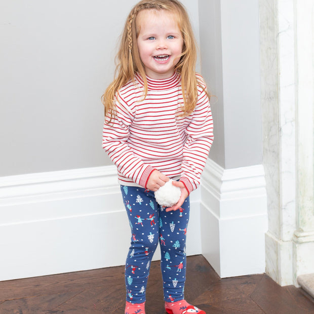 Girl in stripy heart jumper