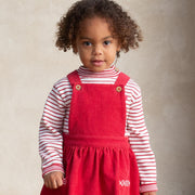 Girl in stripy heart jumper