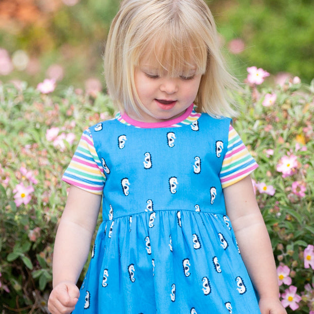 Girl in mini bright stripe t-shirt